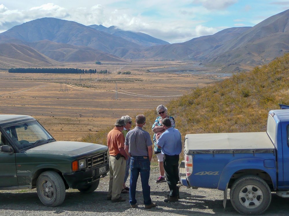 4WD tour group with views over valley