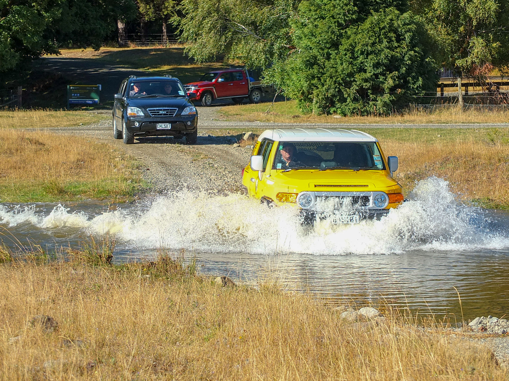 4WD tour fording a river