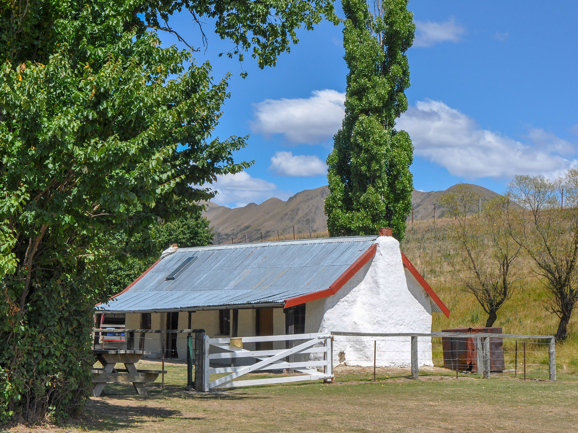 Historic whitewashed Pioneer cob cottage made of mud and straw on Molesworth Station
